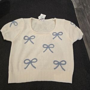 Chic Cream Sweater with Blue Bow Details